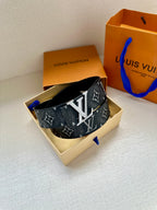 Louis Vuitton monogram belt with dark strap and gold-tone buckle in box