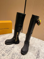 Louis Vuitton unisex black leather knee-high boots, front angle, gold buckle details
