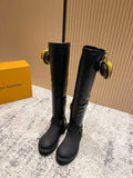 Louis Vuitton unisex black leather knee-high boots with gold zipper pulls and buckles