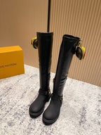 Louis Vuitton unisex black leather knee-high boots with gold zipper pulls and buckles