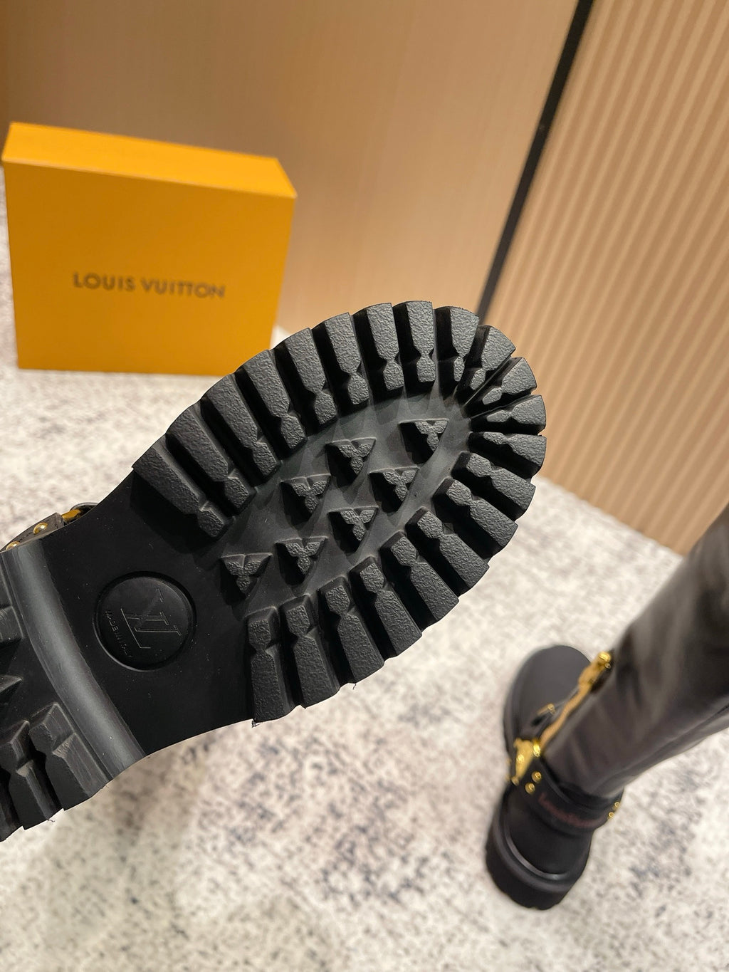 Louis Vuitton unisex black boot outsole with rugged tread pattern and serrated edge