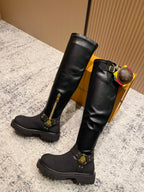 Louis Vuitton unisex black leather knee-high boots with studded straps and chunky sole