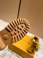 Louis Vuitton unisex boot outsole with LV medallion and rugged treaded rubber