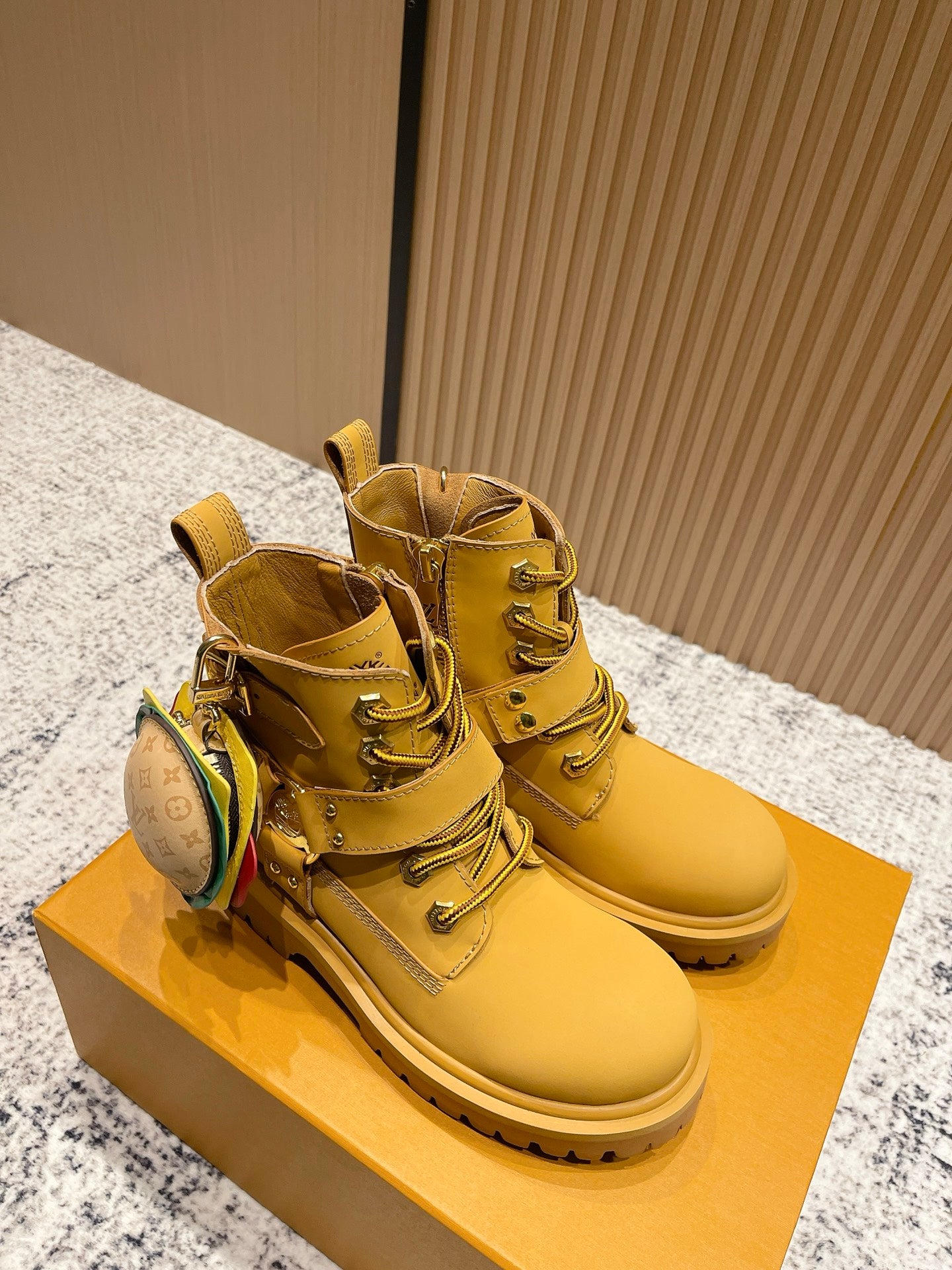 Louis Vuitton unisex yellow high-top boots with buckle straps and LV-pattern pouch