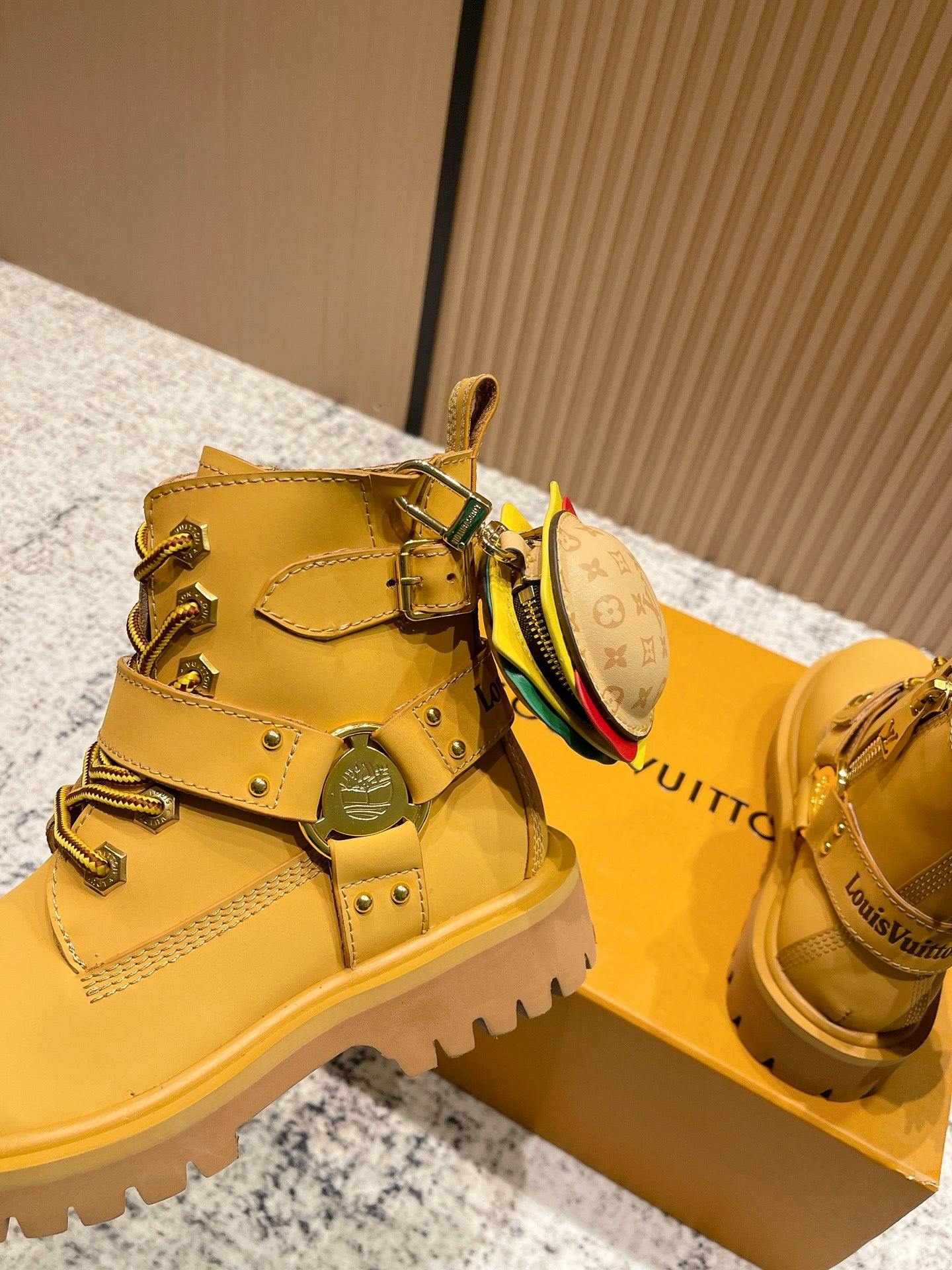 Louis Vuitton unisex yellow boots with buckle straps and small LV-pattern pouch