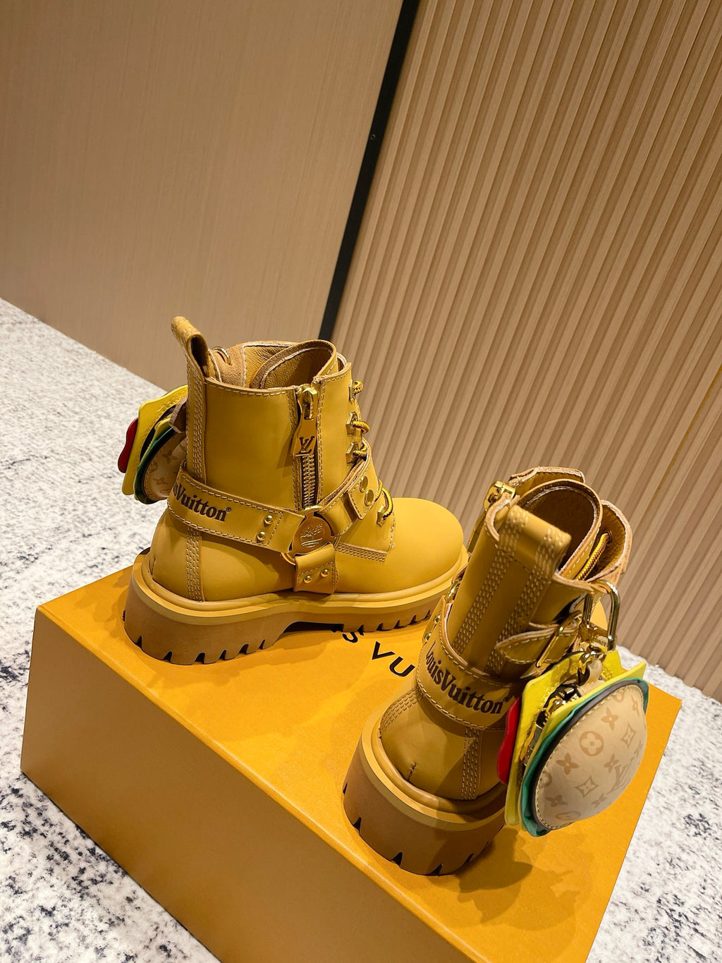 Louis Vuitton unisex yellow ankle boots with lace-up, straps, and round LV pouch
