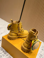 Louis Vuitton unisex yellow ankle boots with lace-up, straps, and round LV pouch