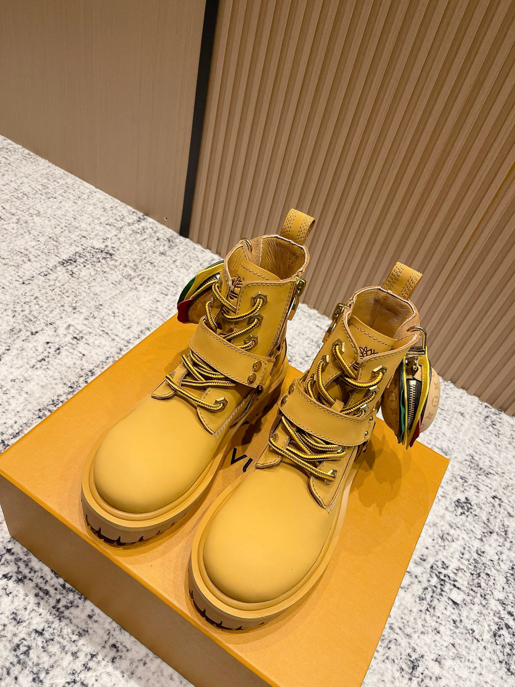 Louis Vuitton unisex yellow high-top boots with lace-up front and chunky rubber sole