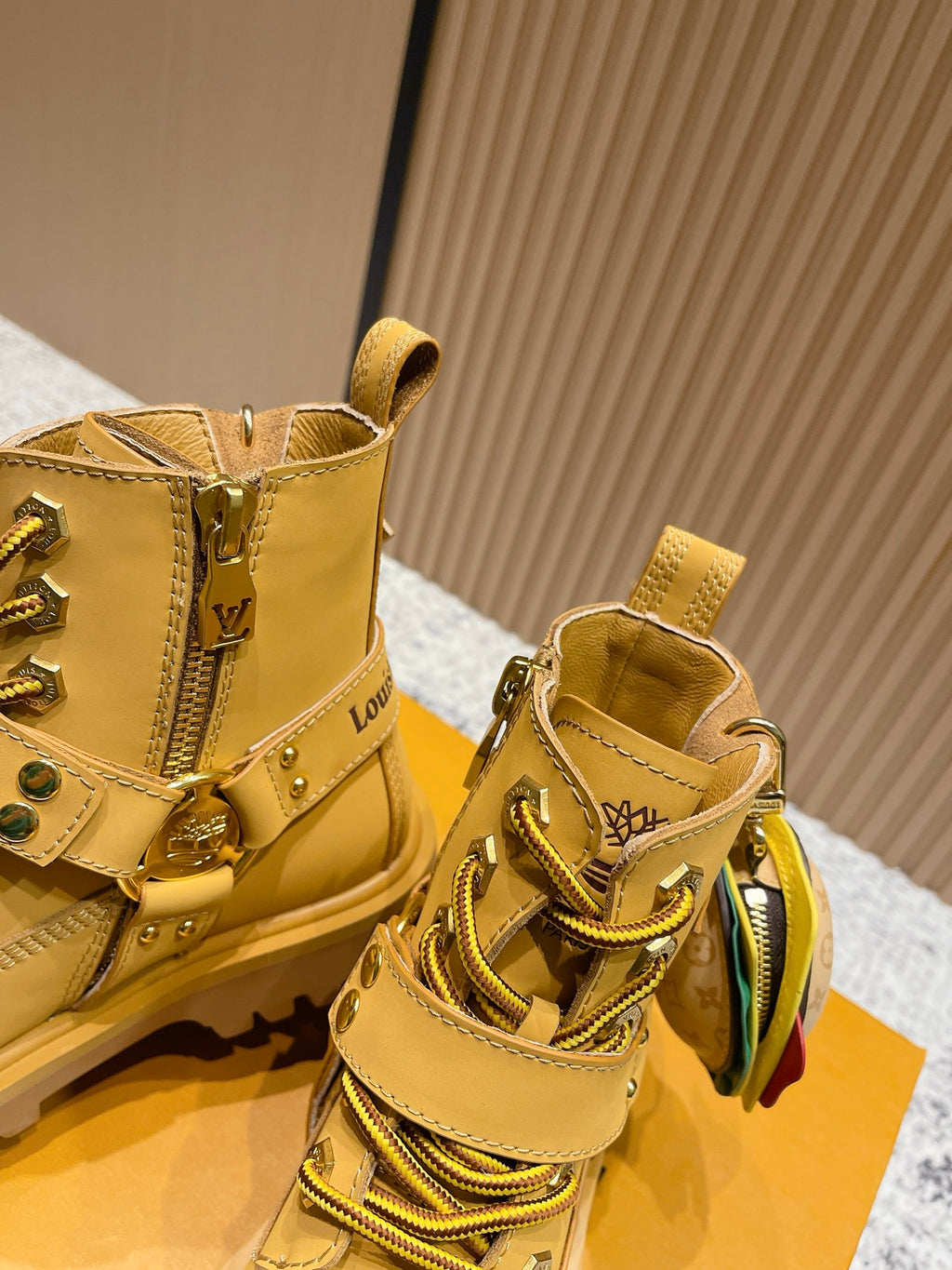 Louis Vuitton unisex yellow lace-up boots with side logo detailing and metal hardware