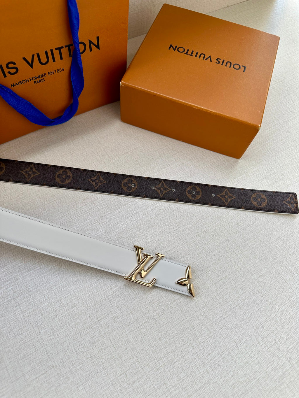 Dark monogram belt with white leather strap and gold LV buckle