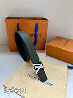 Louis Vuitton leather belt with dark green strap and silver LV buckle, shown curled.