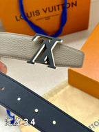 Navy leather belt with gold-tone LV buckle and perforated strap holes