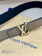 Grey leather belt with gold-tone LV buckle, close-up view of strap