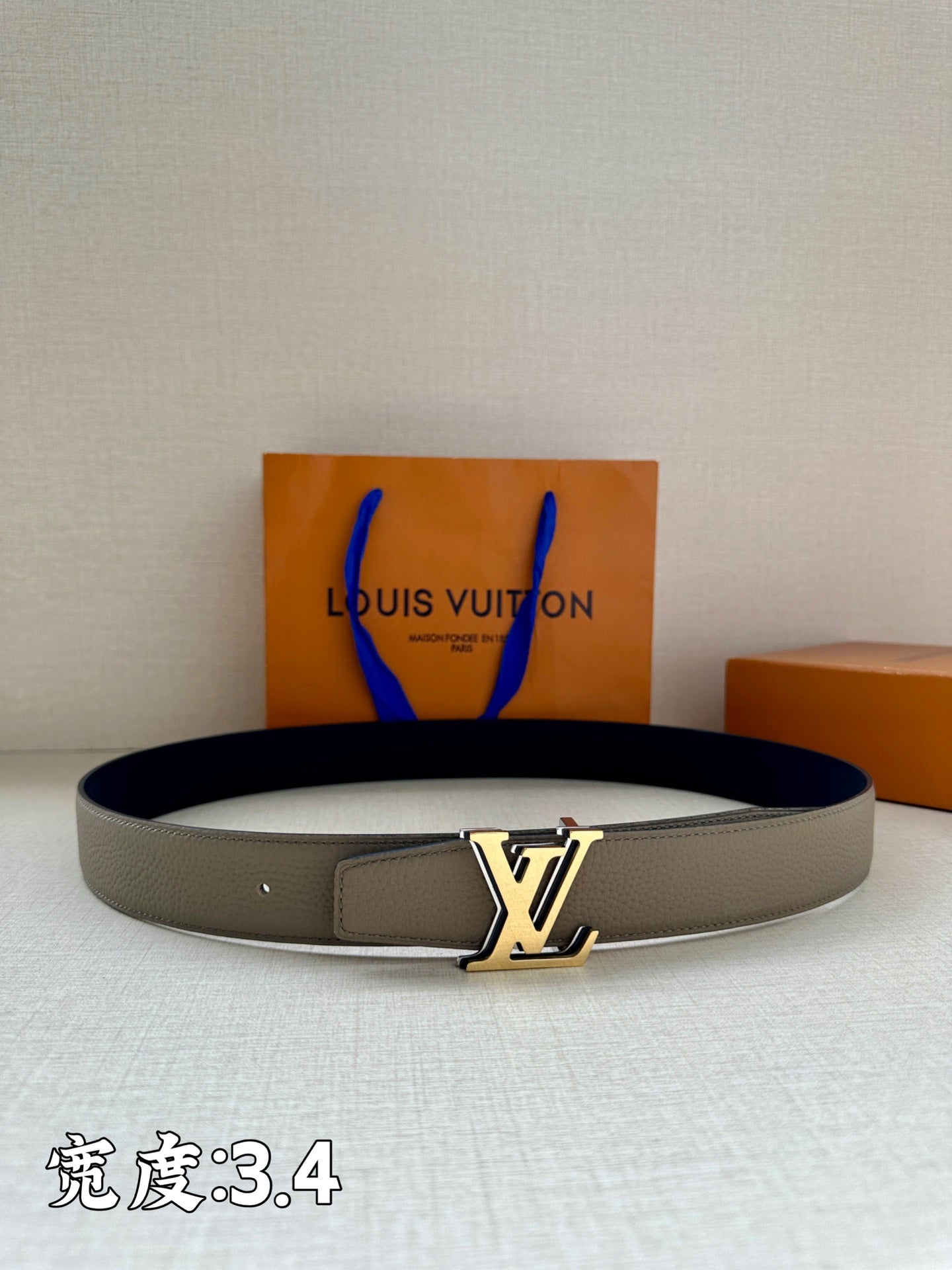 Grey leather Louis Vuitton belt with gold-tone LV buckle