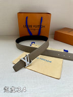 Grey leather belt with gold-tone LV buckle and pin-hole strap