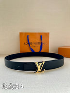 Louis Vuitton leather belt in dark blue with gold LV buckle and keeper