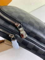 Louis Vuitton damier crossbody bag zipper pull and metal rings on dark trim