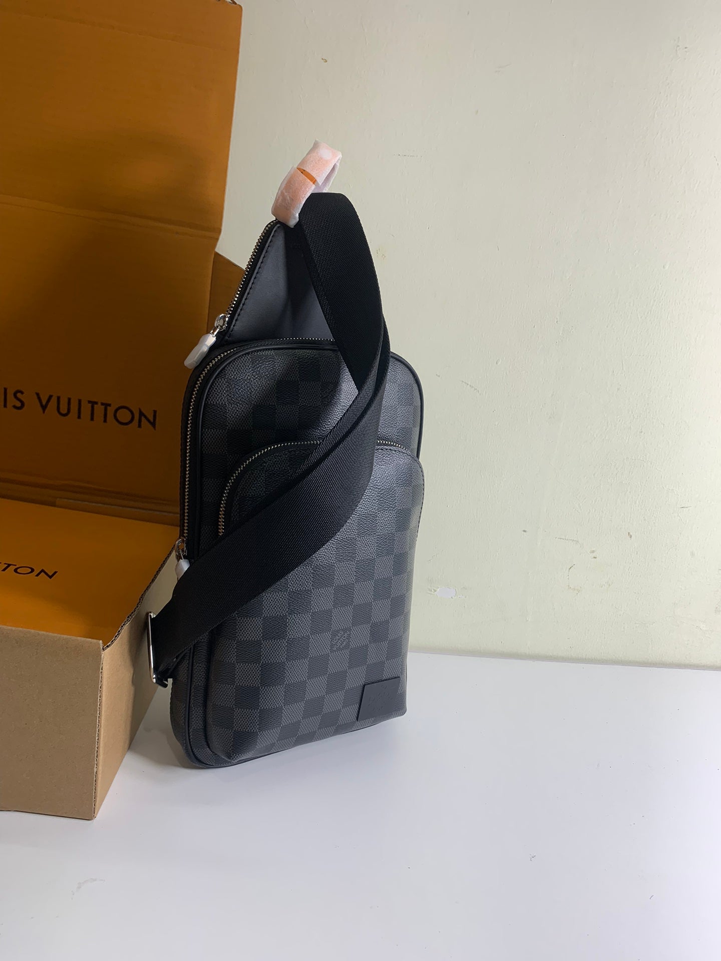 Louis Vuitton damier crossbody bag with dark strap and side profile