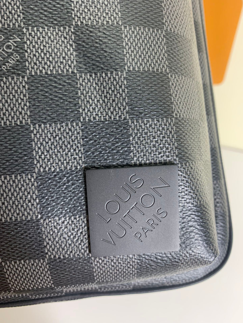 Louis Vuitton Paris leather patch on dark and gray damier-pattern bag