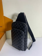 Louis Vuitton crossbody bag with dark Damier check pattern, front zip pocket