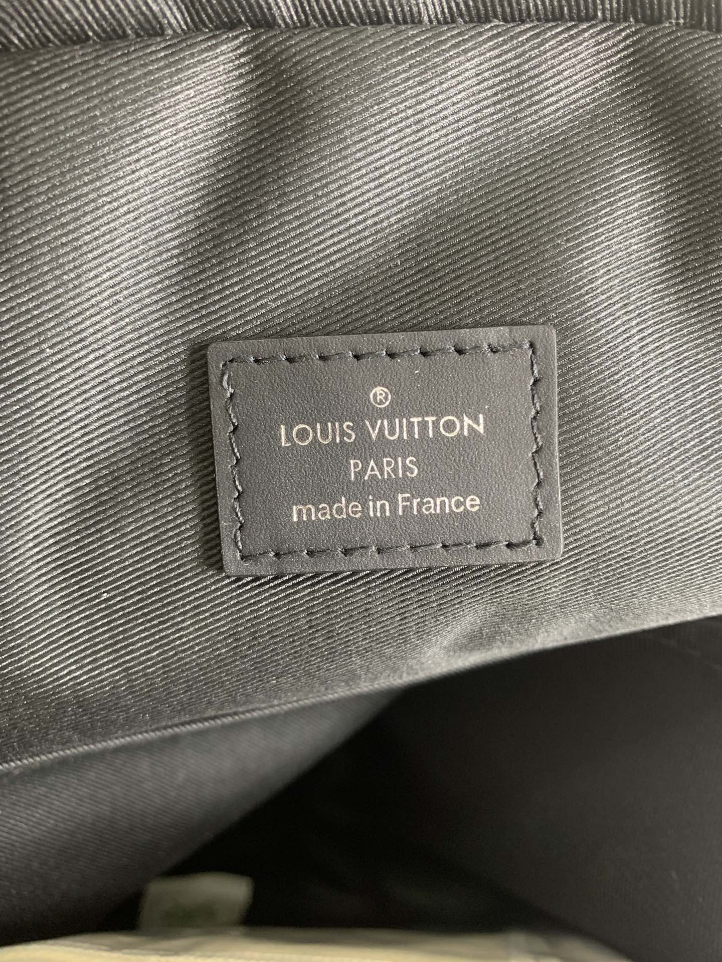Louis Vuitton interior label reading LOUIS VUITTON PARIS made in France