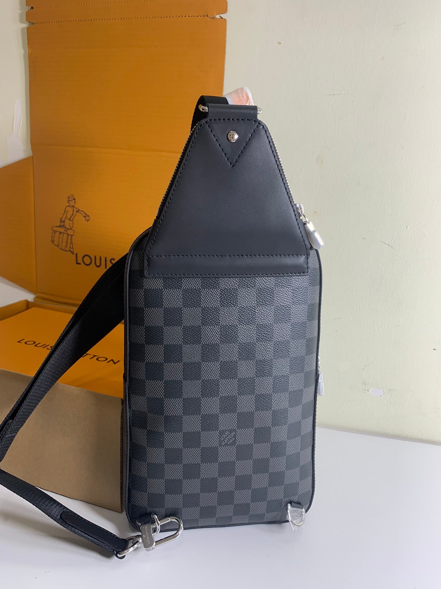 Louis Vuitton damier crossbody bag with adjustable strap, dark checker pattern