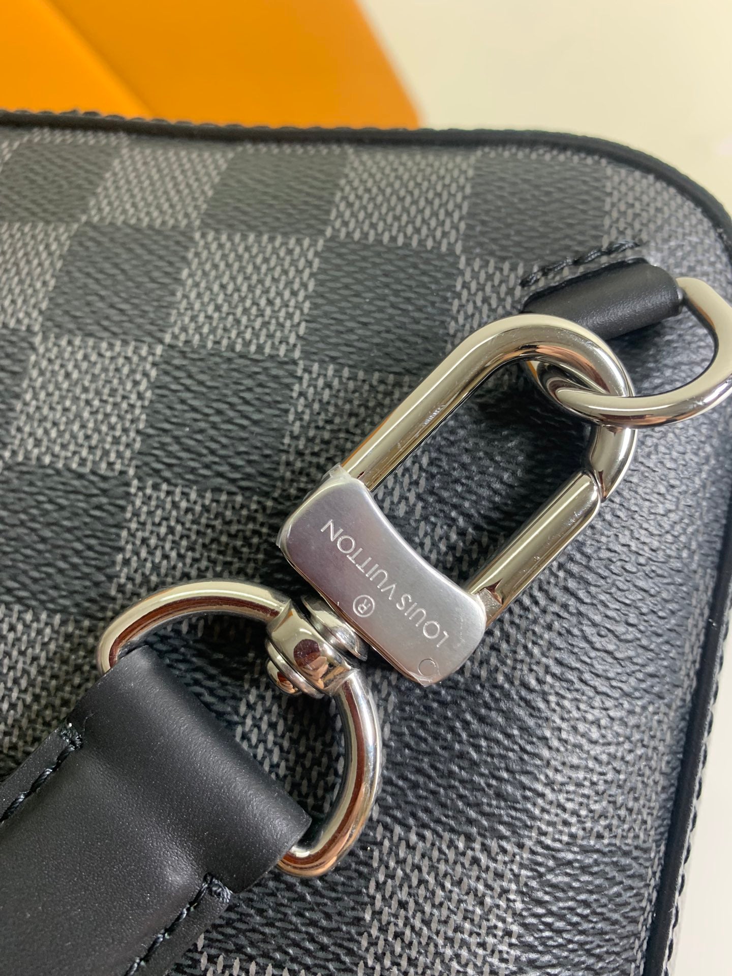 Louis Vuitton damier crossbody bag with metal key ring and clasp near trim