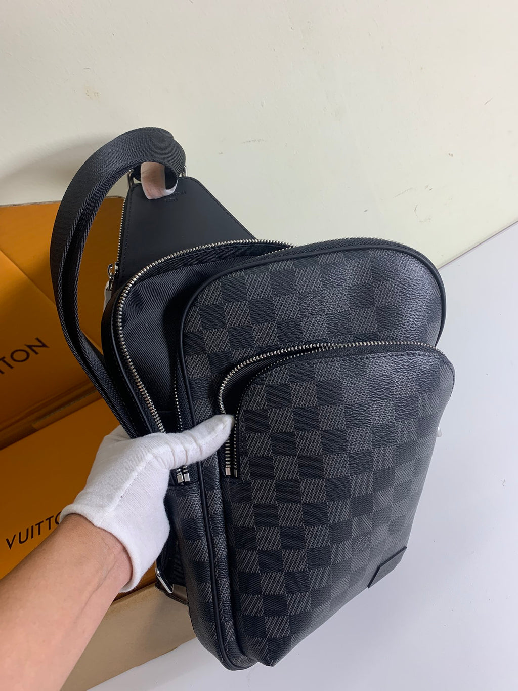 Louis Vuitton crossbody bag with Damier check pattern, front zip compartment and strap