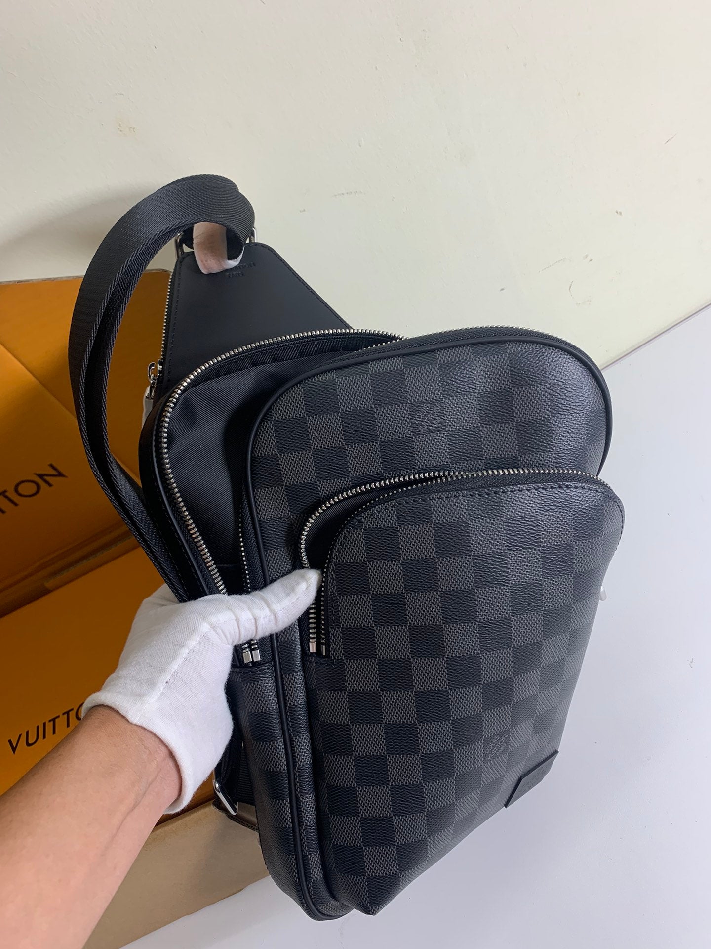 Louis Vuitton crossbody bag with Damier check pattern, front zip compartment and strap