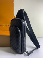 Louis Vuitton damier crossbody bag, side profile with silver-tone zippers and strap