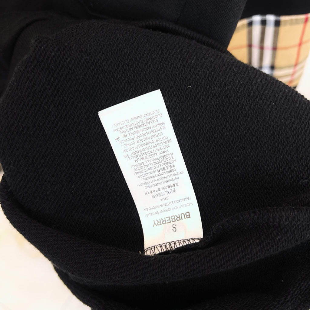 Black Burberry sweatshirt care label inside neck collar