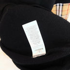 Black Burberry sweatshirt care label inside neck collar