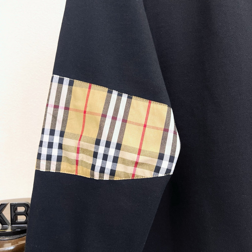 Black Burberry sweatshirt with plaid panel detail on sleeve
