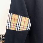 Black Burberry sweatshirt with plaid panel detail on sleeve