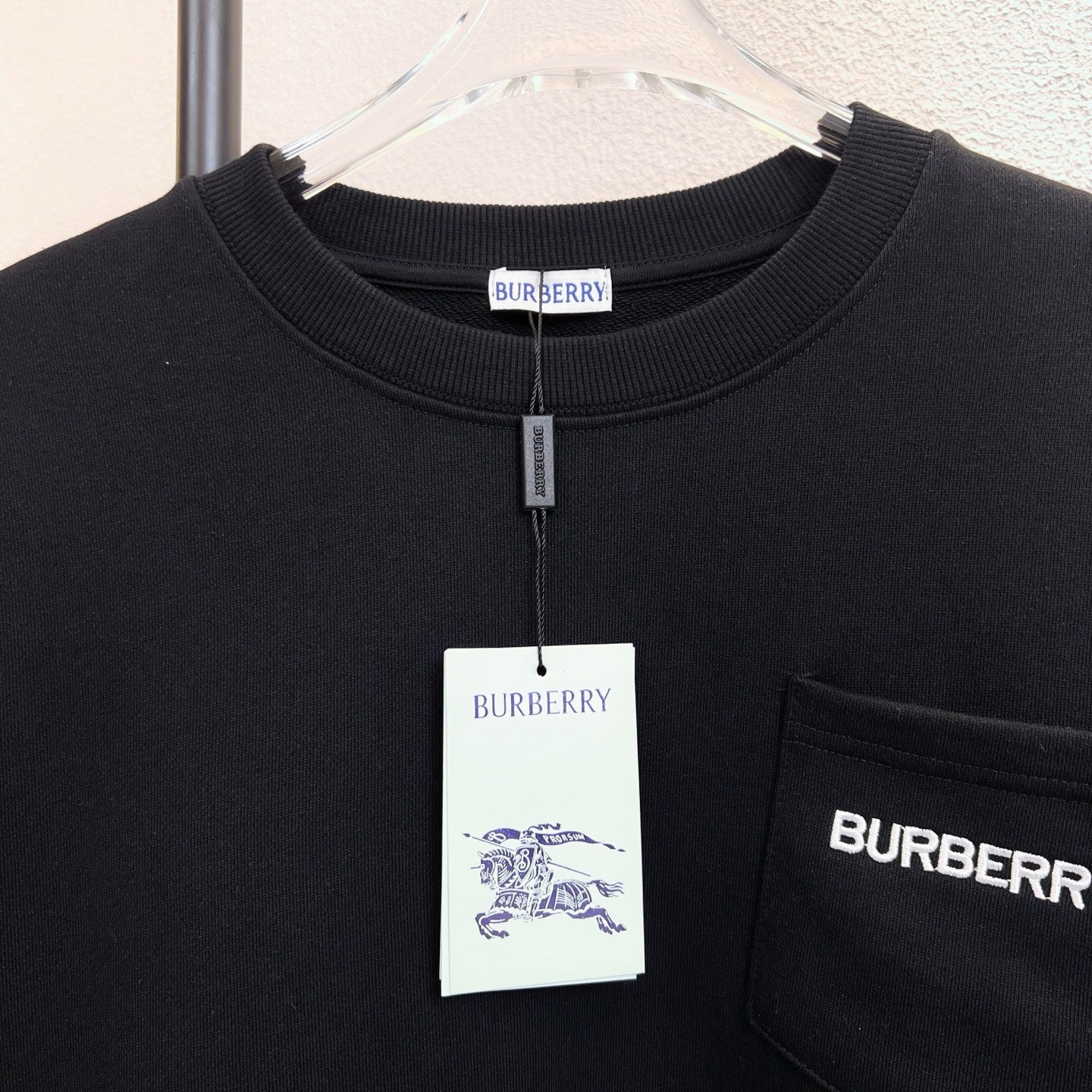 Black Burberry sweatshirt neckline detail with hanging size label