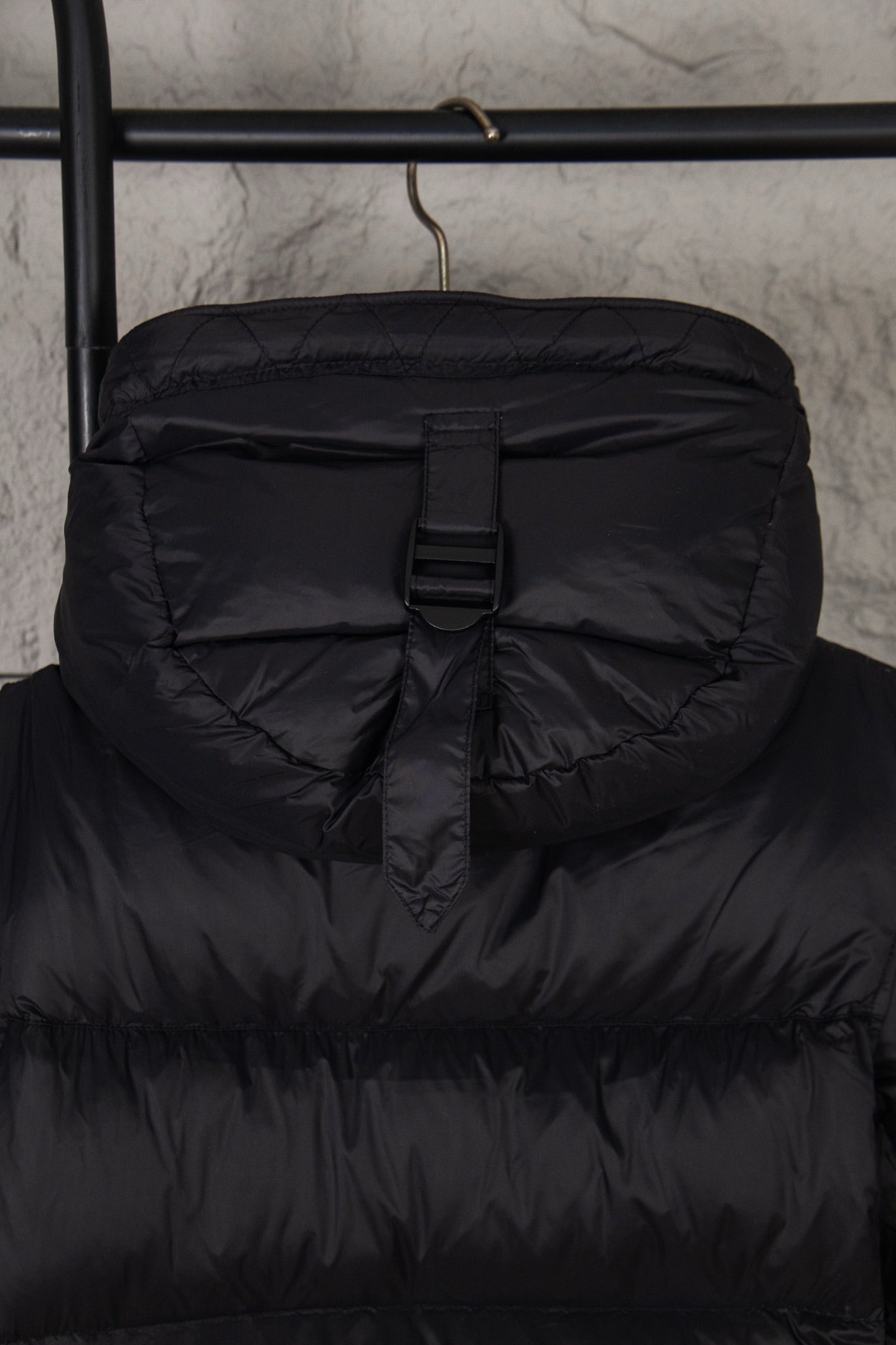 Long puffer coat front with zipper and drawstring waist, dark fabric