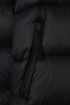 Black puffer jacket front zipper with fabric pull tab and quilted paneling