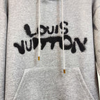 Gray Louis Vuitton hoodie front with black text graphic, white drawstrings, and pocket.