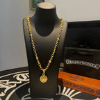 Gold-tone chain necklace with round medallion pendant