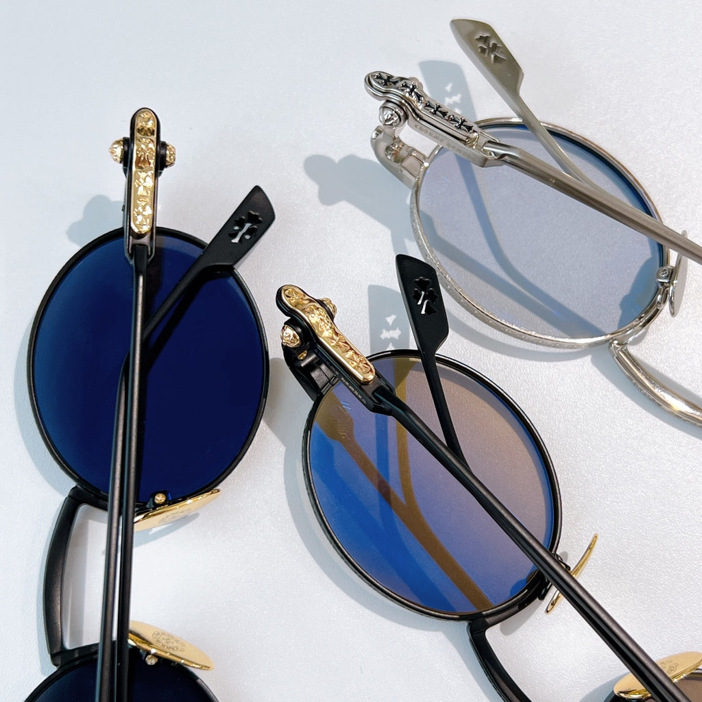Chrome glasses assortment with blue-tint lenses and mixed frame tones, shown from side angles.
