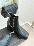 Ladies dark ankle boots with gold chain trim, logo on side, block heel