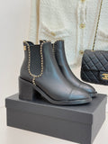Ladies quilted-heel ankle boots with gold chain detail and rounded toe