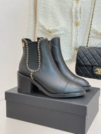Ladies quilted-heel ankle boots with gold chain detail and rounded toe