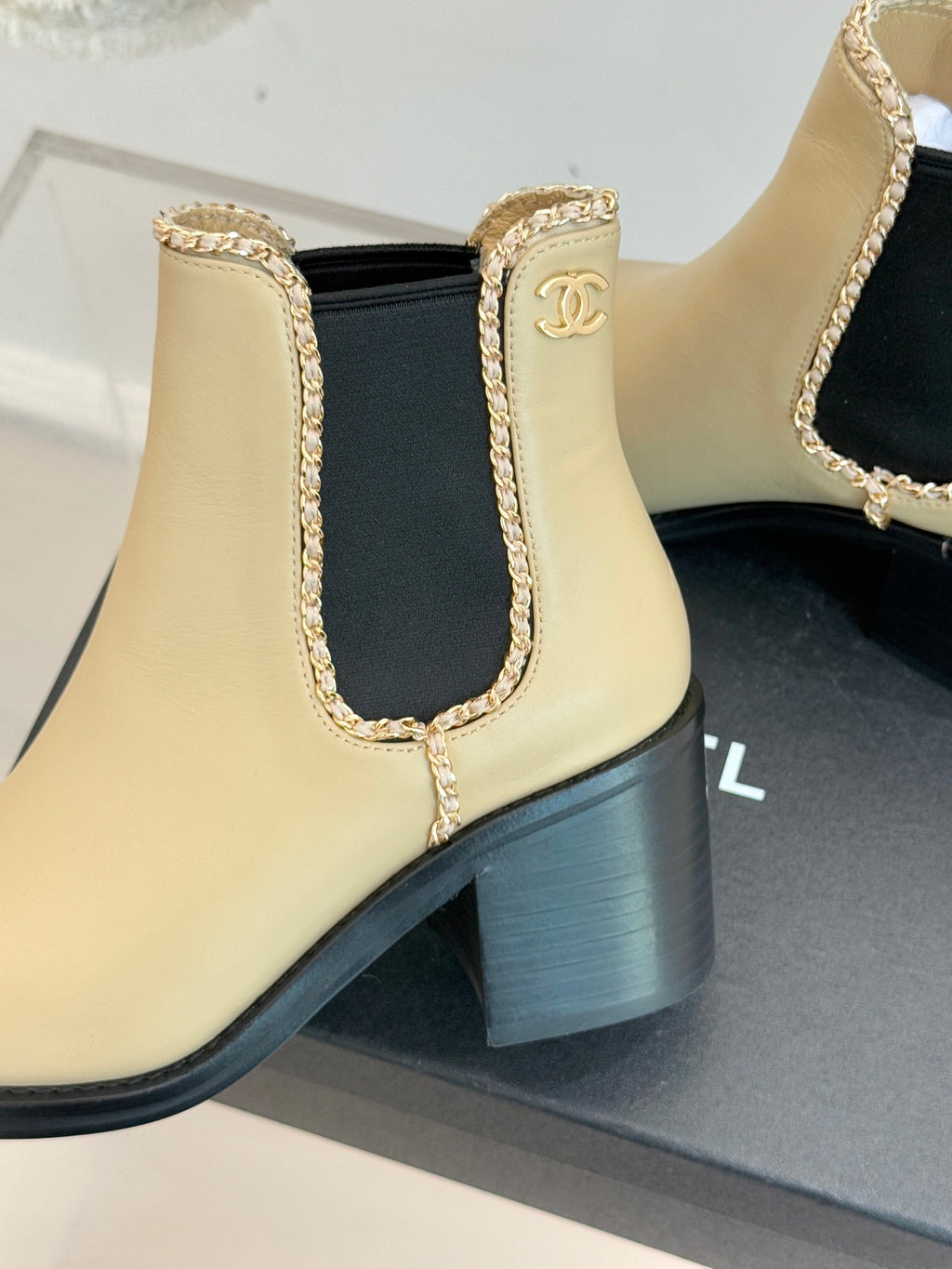 Women’s chelsea ankle boots, cream leather with black heel and Chanel logo patch
