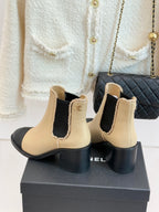 Women’s chelsea boots, cream leather with black heel and side Chanel emblem
