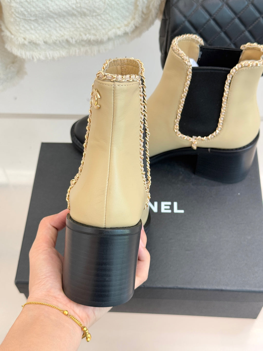 Women’s chelsea ankle boots, cream leather with black heel and side cutout detail
