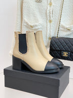 Women’s chelsea ankle boots, cream with black block heel and stitched trim