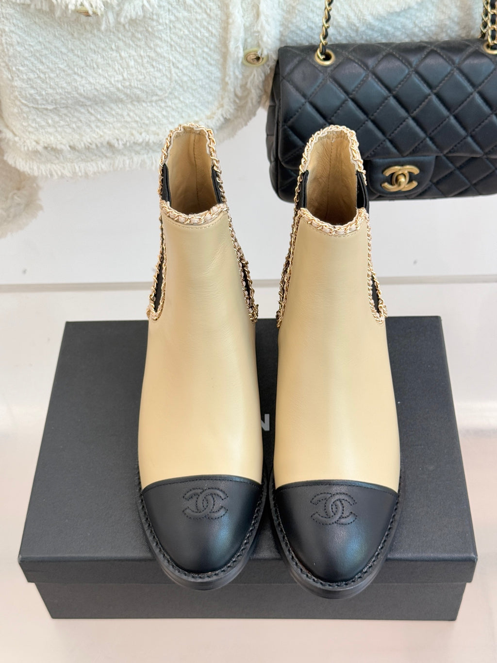 Women’s chelsea boots, cream leather with black sole and Chanel logo on toe