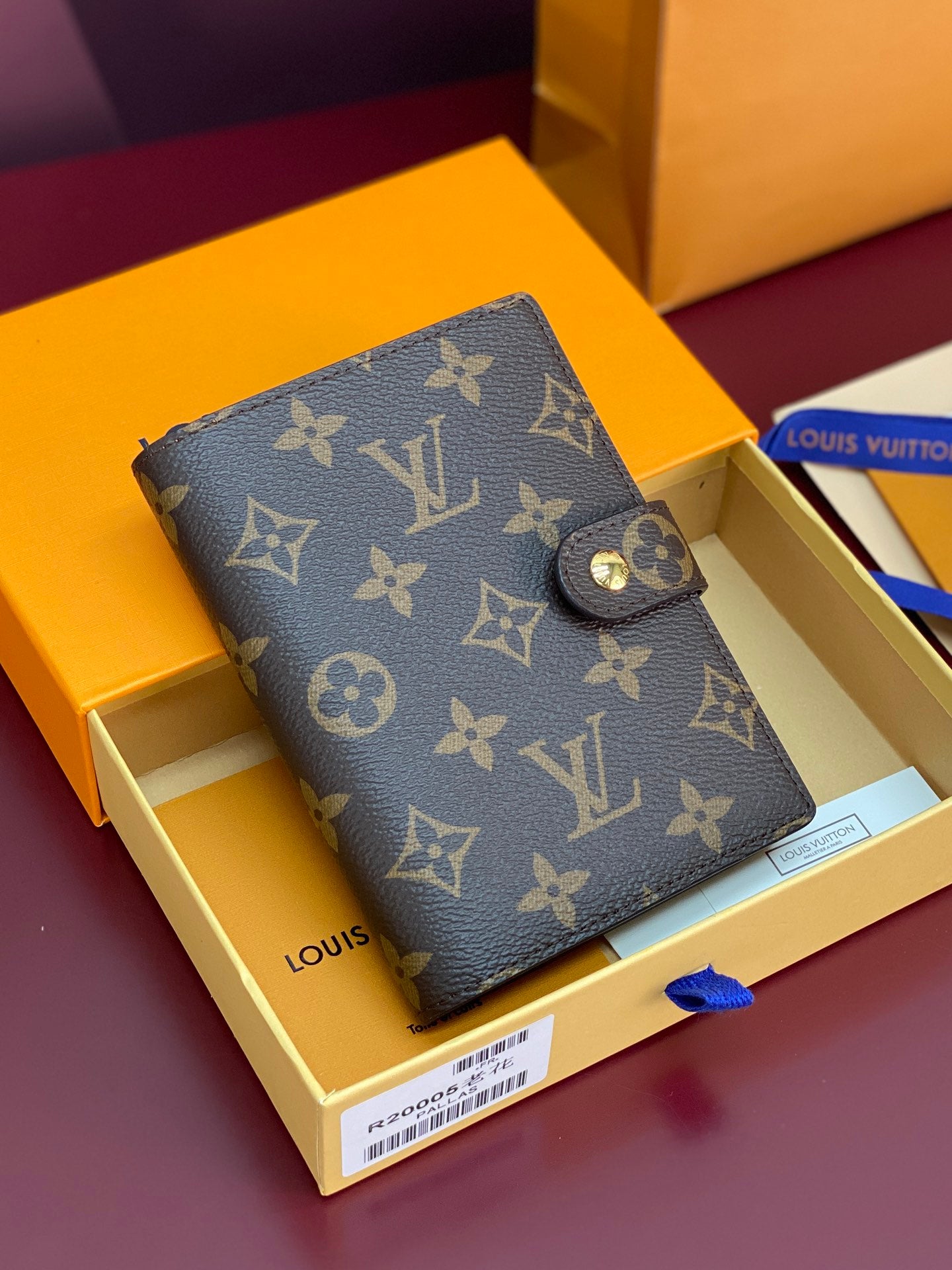 Brown Louis Vuitton monogram small bag with snap button and gold-tone hardware