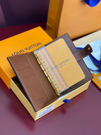 Brown Louis Vuitton small bag with notebook insert and gold ring binder